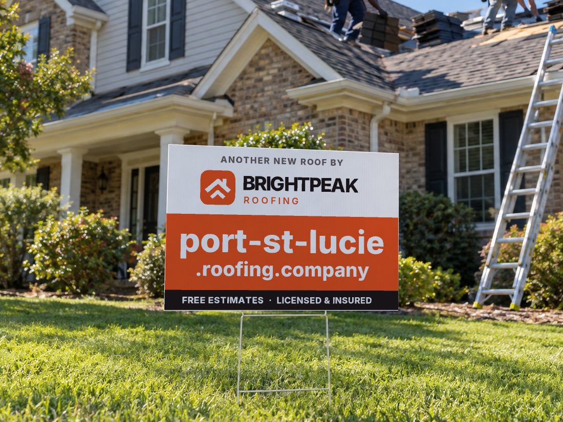 port-st-lucie.roofing.company on a yard sign in front of a house getting a new roof